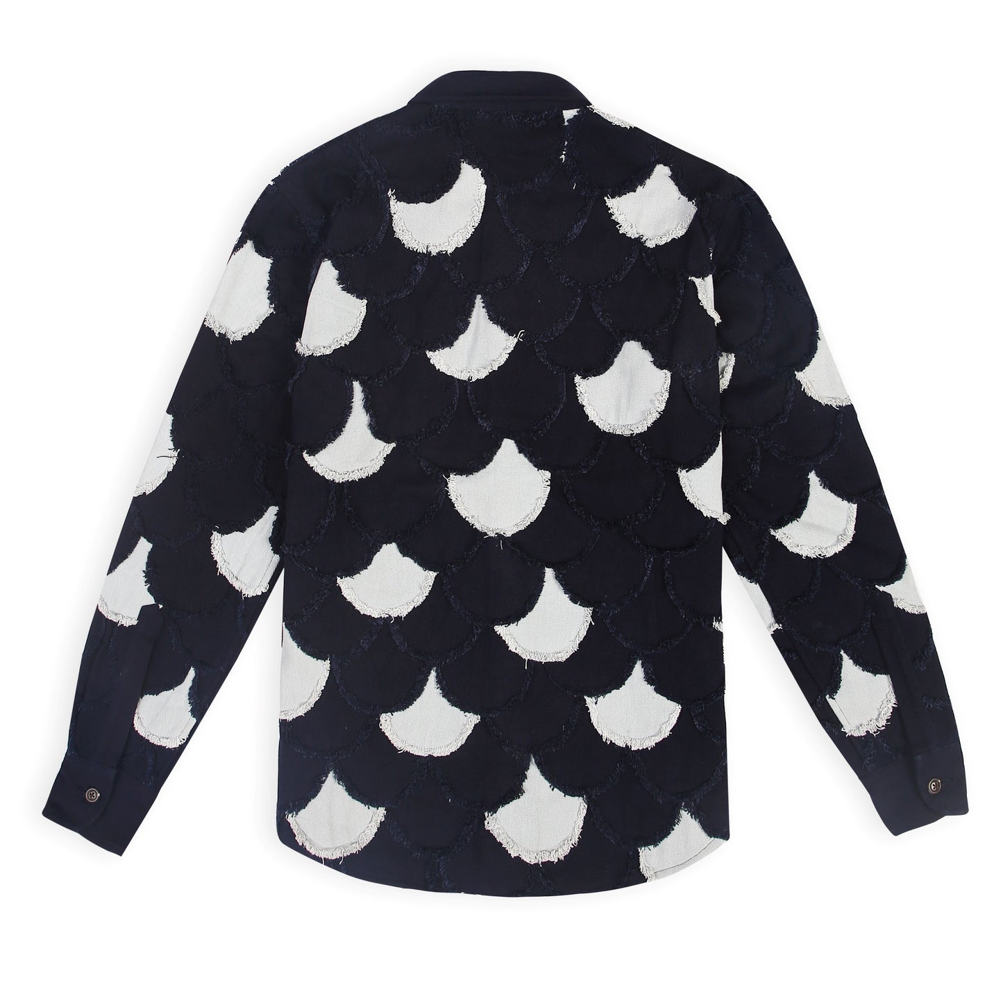A picture of the Arden Unisex Denim Jacket with eyelash fringe from the front. It reads,
"Unisex denim jacket with patchwork design and handmade eyelash fringe" and "Arden
denim jacket in light blue and navy with fringe details."