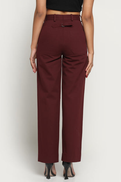 Maroon pants worn by a person on a white background