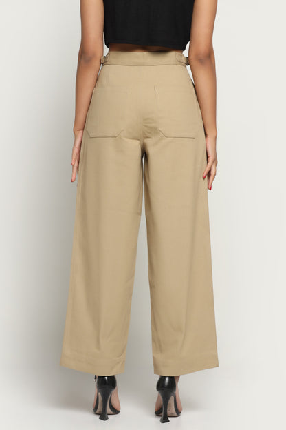 Beige wide-leg pants worn by a person on a white background