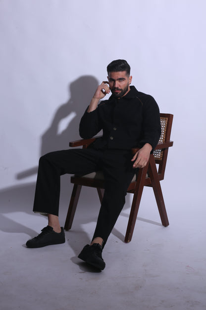 Man sitting on a chair with a white background