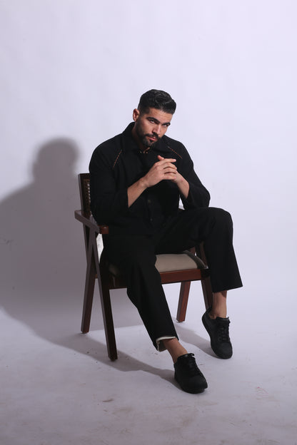 Person sitting on a chair with a white background