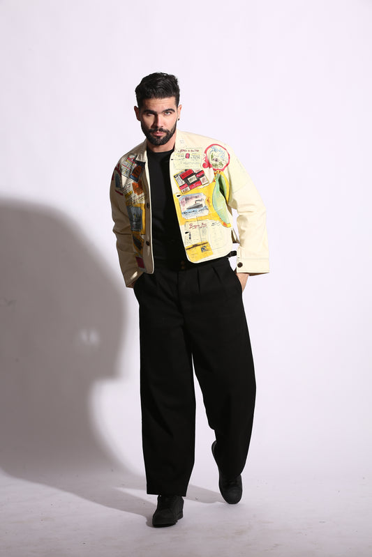 Man holding a colorful book against a white background