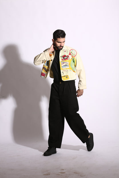 Person wearing a colorful outfit with a shadow on a white wall