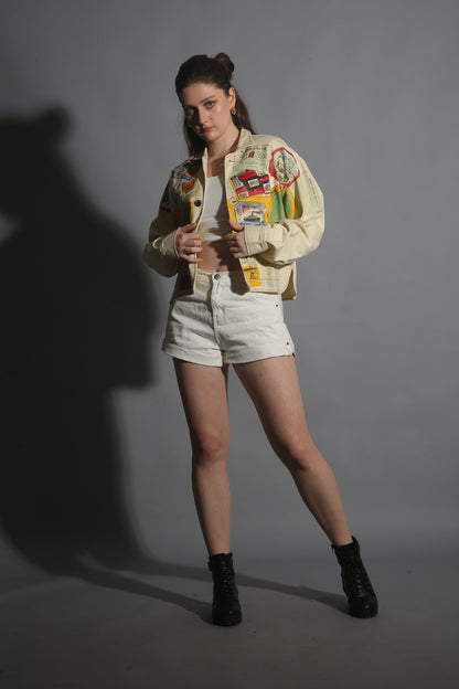 Woman wearing a colorful jacket with a gray background