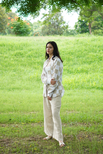 Handcrafted style linen shirt featuring alternating square patches of oatmeal and white fabric.