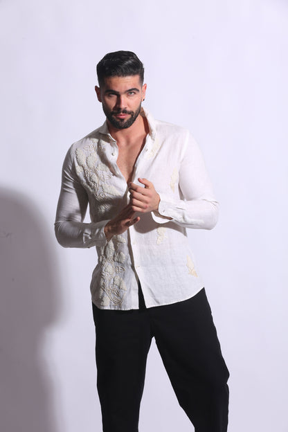 Maglia Chic white linen top; features embroideries on the front with lace + hip stitching 