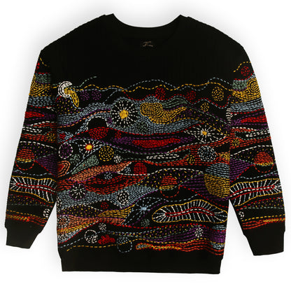 Black sweater with colorful abstract pattern on a white background