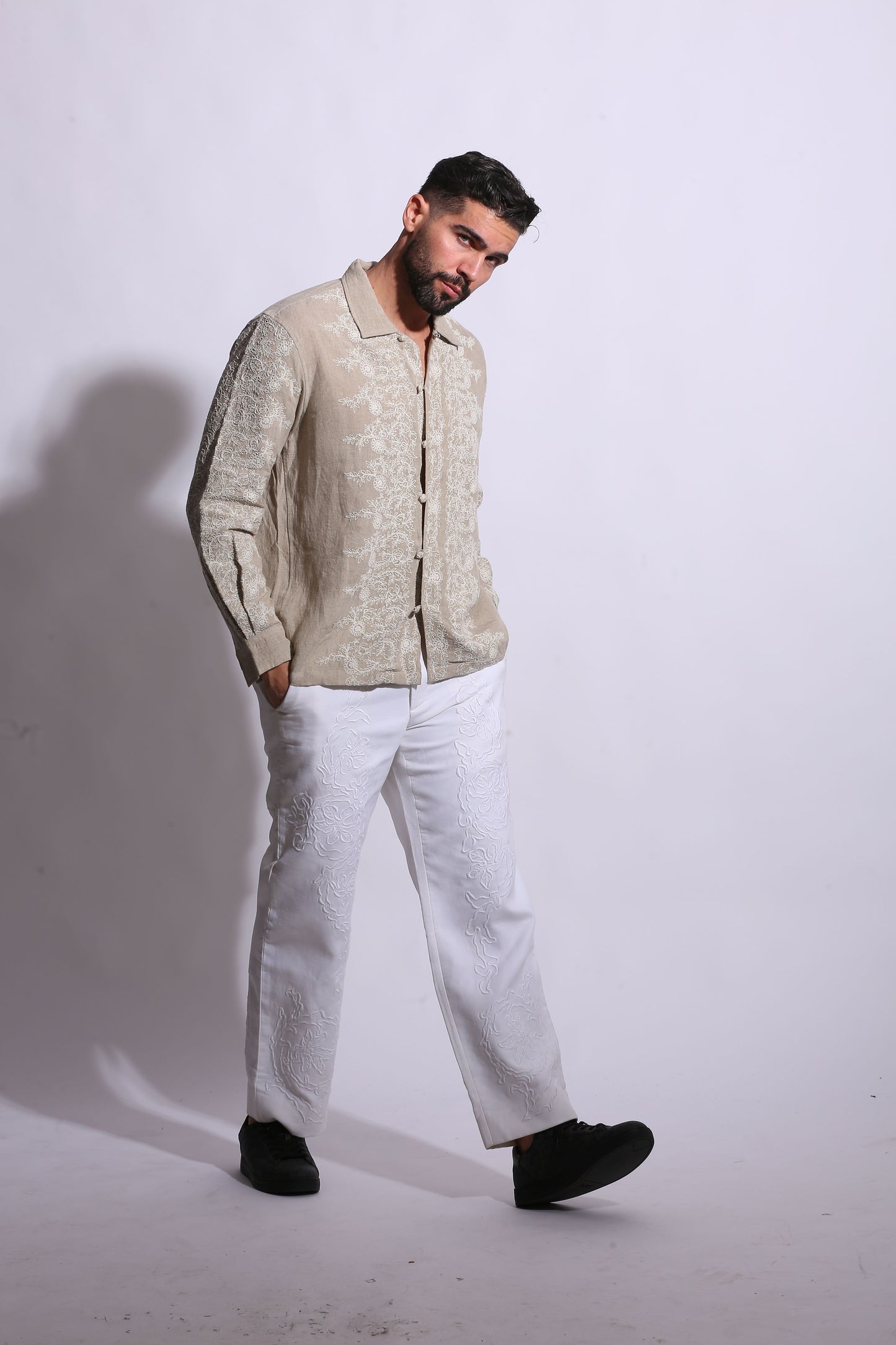 Textured beige linen shirt with traditional Chinese-style knotted buttons and a relaxed, sophisticated fit.