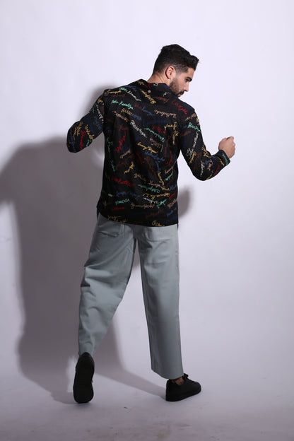 “Statement chords on satin black all-over embroidered cotton shirt” 
