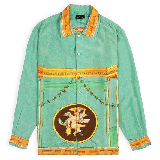 A green silk shirt with a detailed festive print, including a central graphic with a bird and surrounding decorative elements, with a collar and button-up front.