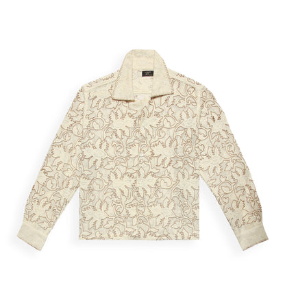 A beige long-sleeved shirt with floral embroidery, crafted from sheer cotton jacquard lace fabric.